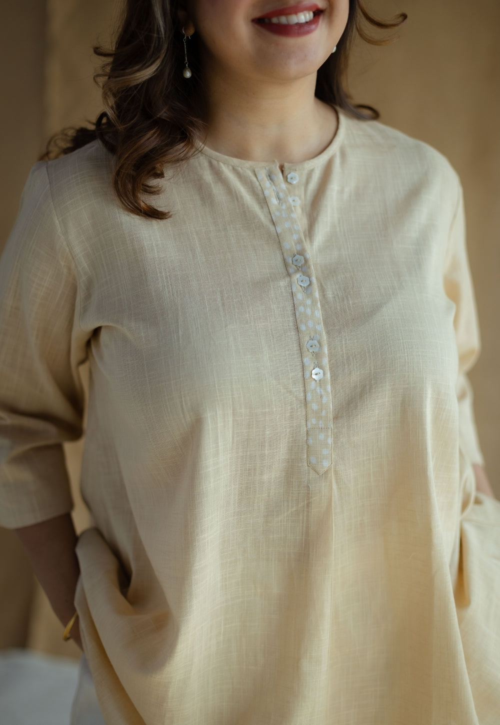 Afifa Cream Solid Slub Cotton A Line Short Top